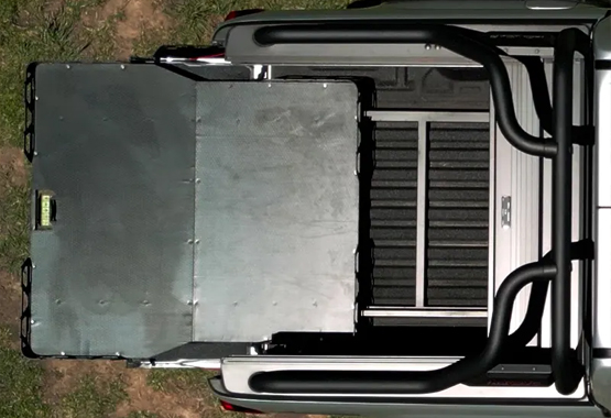 hsp load slide tray slide 4x4 ute retractable loading platform installed in the tub of a pickup truck 4WD 4x4, allowing the entire floor to slide out for easy access to tools, camping gear, or fridges