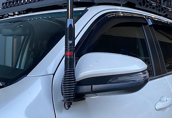 4WD touring vehicle fitted with a UHF aerial and vehicle-specific bracket