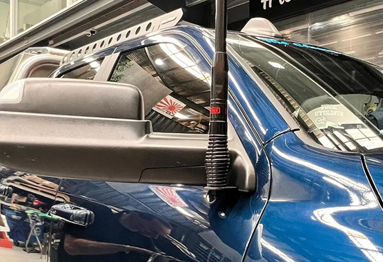 Low-profile UHF aerial bracket installed neatly on a modern 4WD